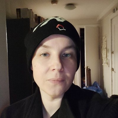 Portrait of author Steve Hugh Westenra wearing a black beanie and black shirt